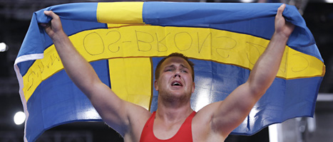 En överlycklig Jimmy Lidberg jublar efter att ha tagit bronsmedaljen i 96-kiloklassen i brottning. FOTO: Paul Sancya/SCANPIX