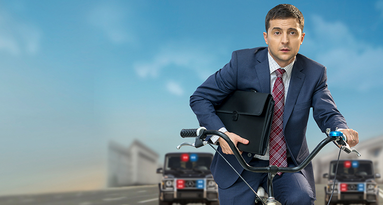 Volodymyr Zelenskyj på en cykel.