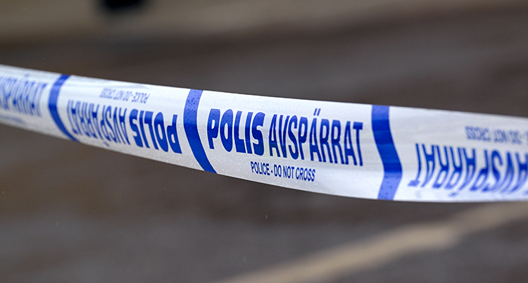Ett blåvitt band som poliserna använder som avspärrning.