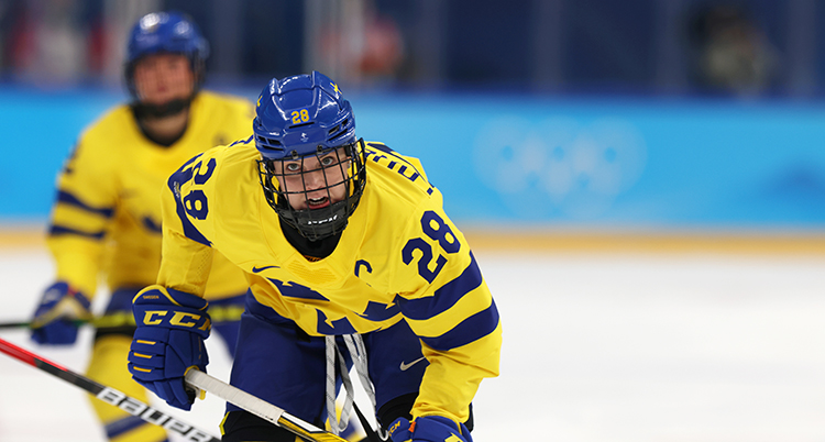 Kvinnlig ishockeyspelare.